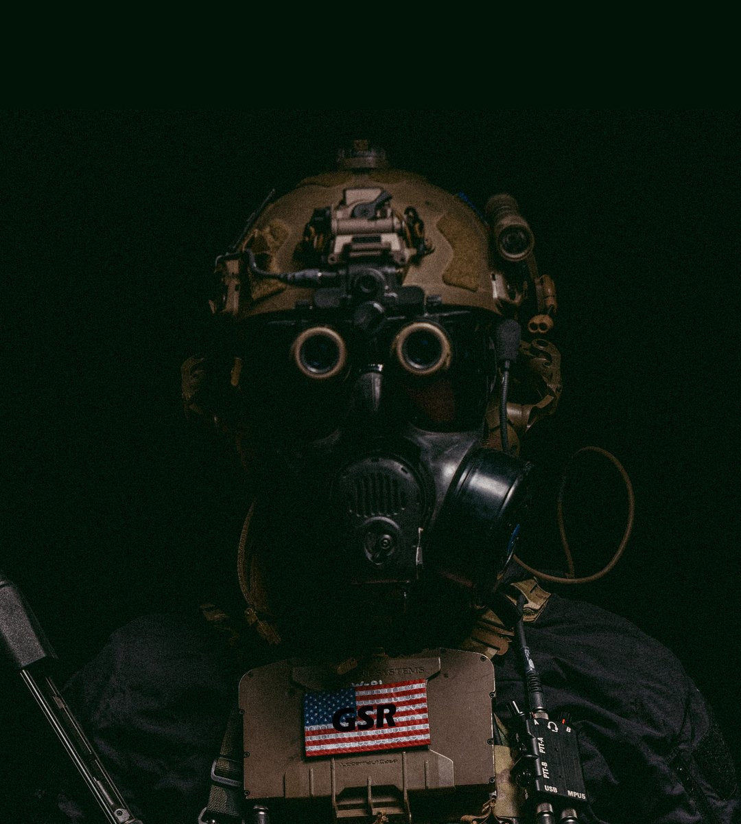 Operator in a gas mask with a GSR flag patch